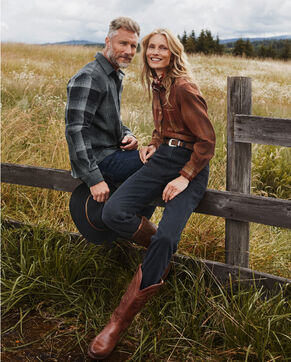 Man and Woman staging outside wearing Centennial Plaid shirts