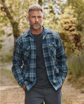 Man standing outside wearing a Board Shirt