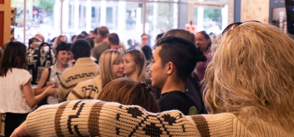 Inside the Pendleton store in downtown Portland, Oregon, a crowd mills around at a #dudecon party.