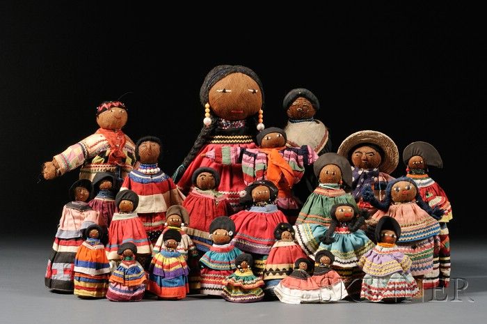 A museum display of tourist dolls dressed in Seminole strip dresses