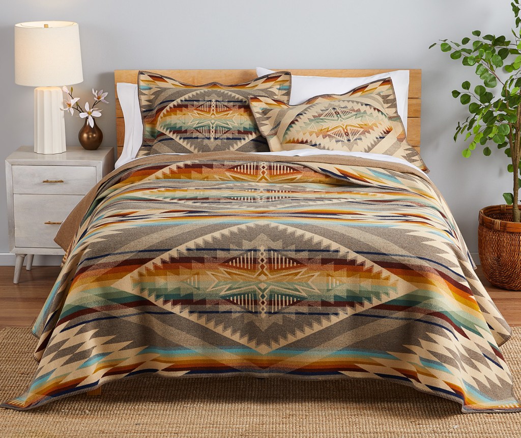 The Summerland blanket on a bed, with matching pillow shams.