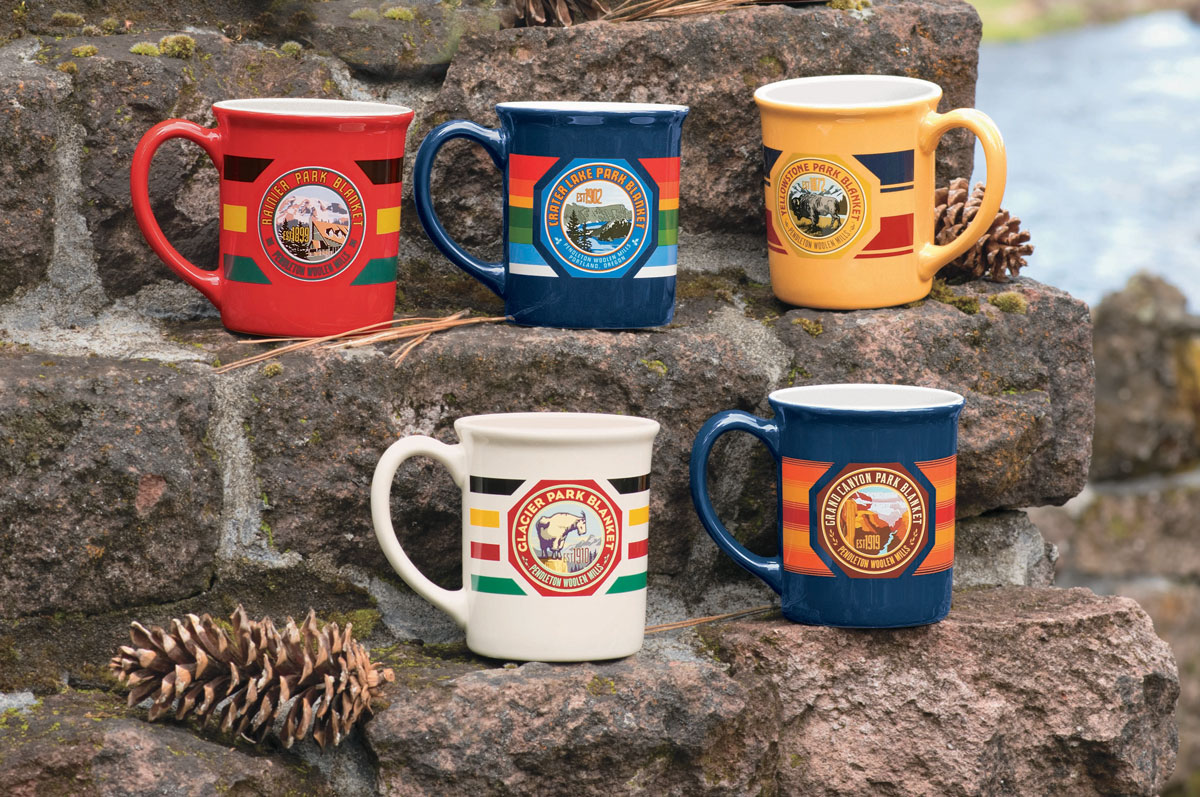 Pendleton's oversized mugs, emblazoned with the labels and stripes of  Pendleton national Park blankets, are set out on a rustic set of steps made from weathered bricks. 