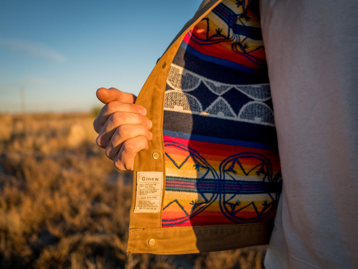 A photo of the interior of a Ginew work jacket, lined with Pendleton wool in the "We Walk Together" pattern. 