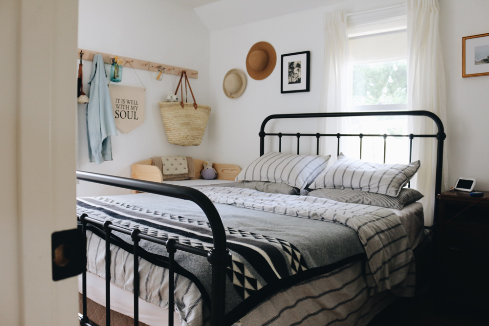 Bri_Heiligenthal shot of a bed with black, white, and grey bedding