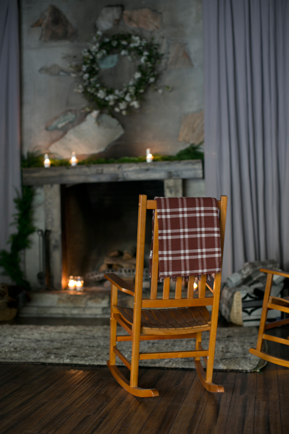 rocker with a Pendleton throw by the fireplace