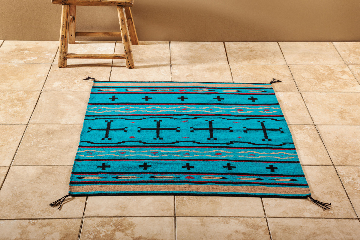 Handwoven Navajo rug on a tile floor