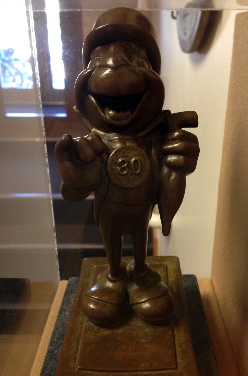 A small bronze statue of Jiminy Circket, given to Pendleton Woolen Mills to mark 30 years of association.