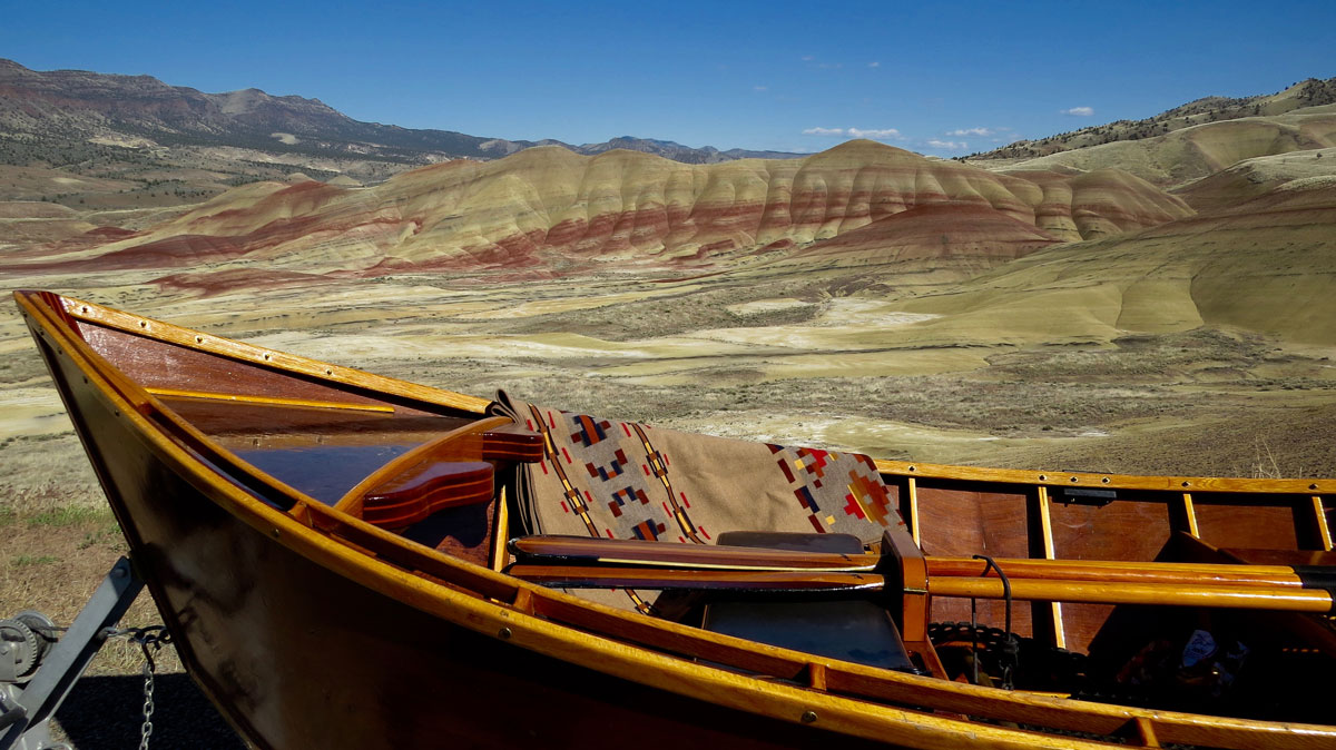 The Painted HIlls blanket by Pendleton, at Oregon's Painted Hills. Photo and hand-built wooden boat by Greg Hatten