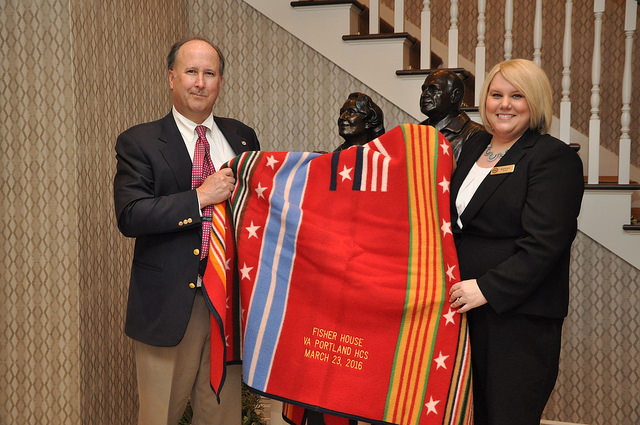 John Bishop, Pendleton CEO, presents a special, custom-embroidered Grateful Nation Pendleton blanket to the staff at this newest location.