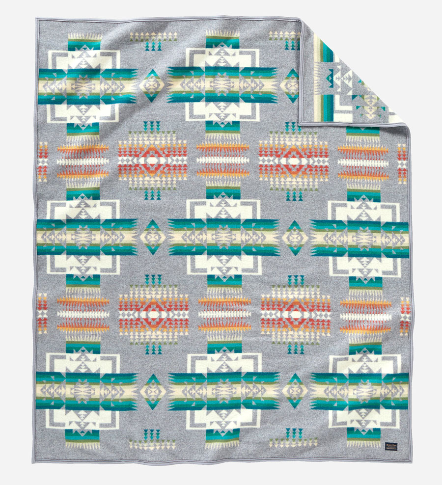 The Chief Joseph blanket in grey, turquoise, green, white, and orange,by Pendleton