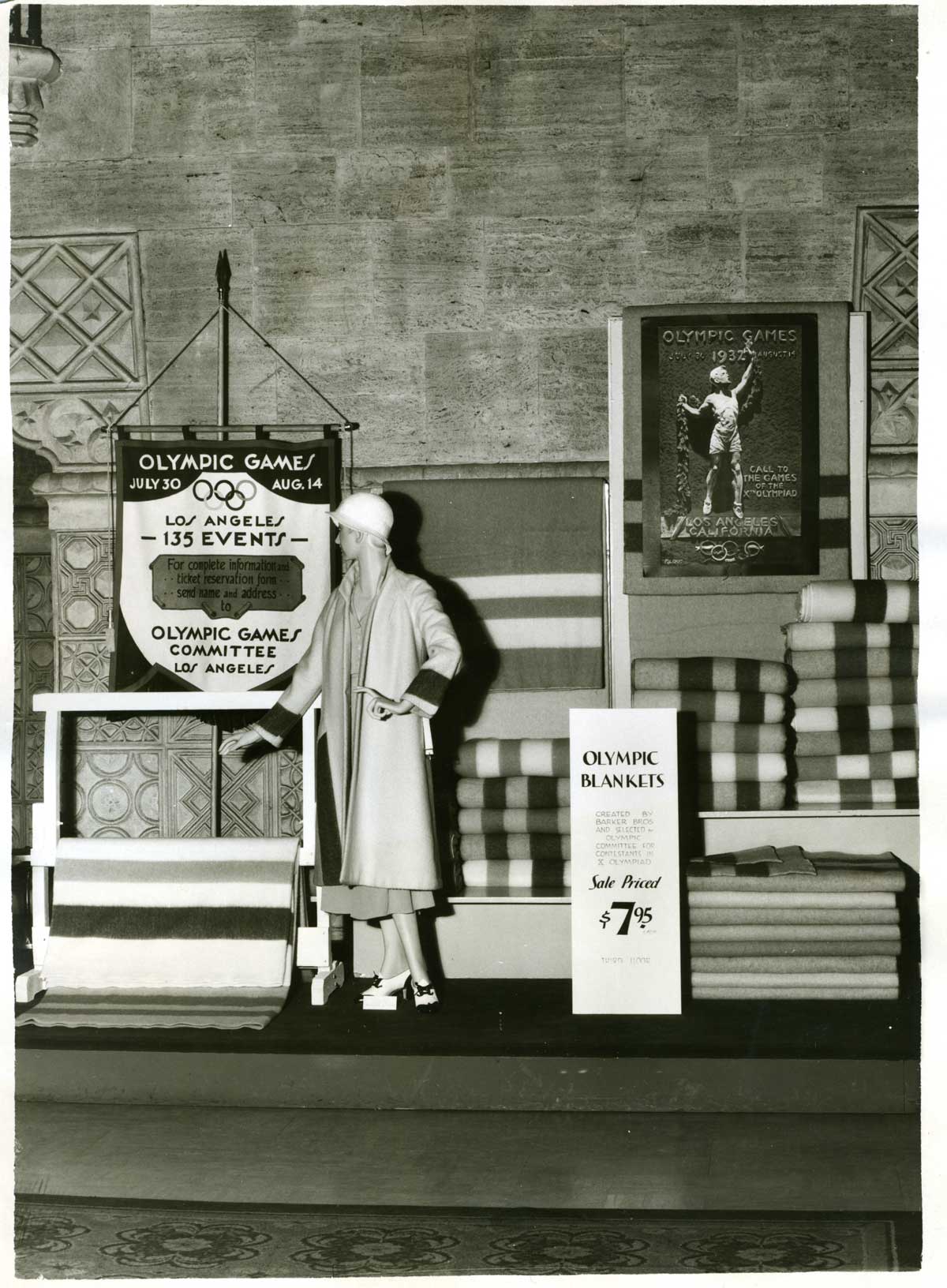 A display with striped blankets and some outerwear honoring the 1932 Olympic games in Los Angeles