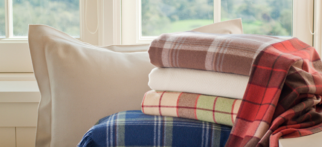 A stack of Pendleton Eco-Wise Wool products.