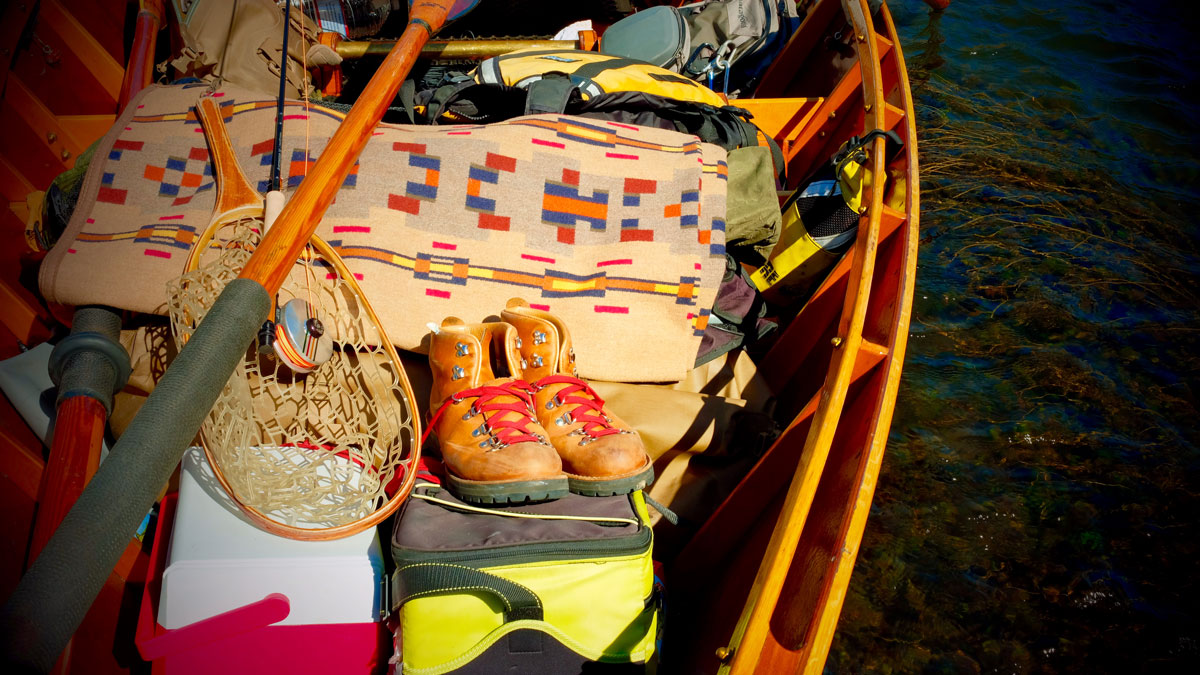 RIver running gear in Greg hatten's wooden boat, including the Painted HIlls blanket by Pendleton. Photo by Greg Hatten