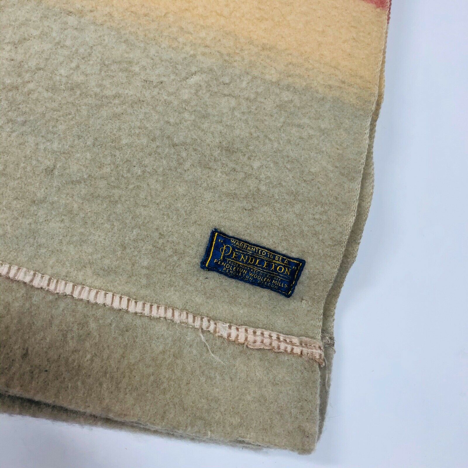 The corner of the 1940s version shows a blue and gold embroidered Pendleton label.