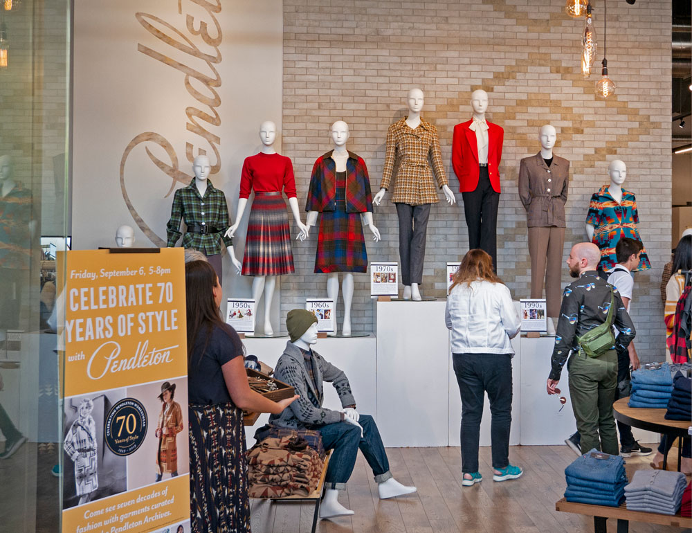 Interior of Pendleton store with row of mannequins wearing vintage Pendleton women's clothing