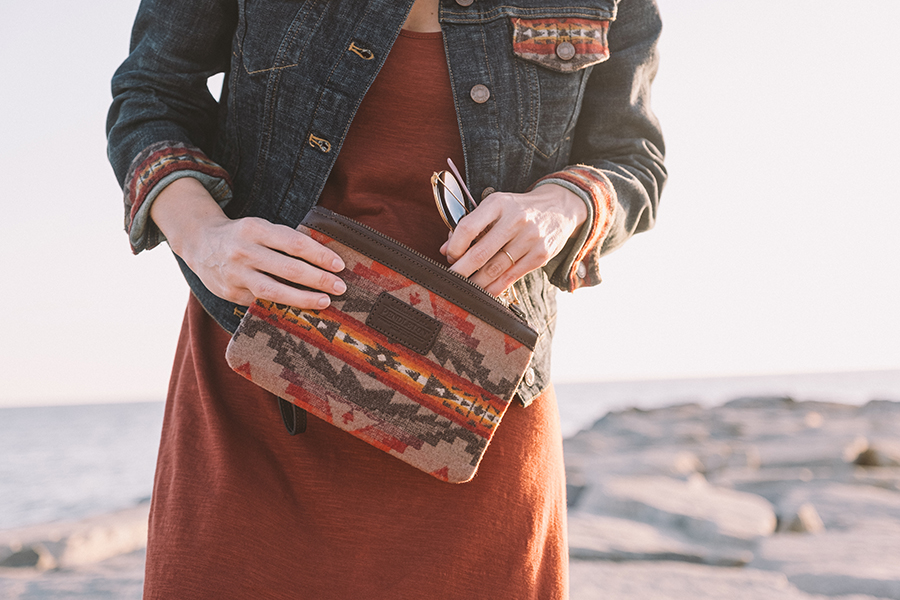 A woman holds a Sierra Ridge bag.