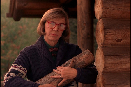 the log lady wears a vintage Pendleton sweater and carries her log