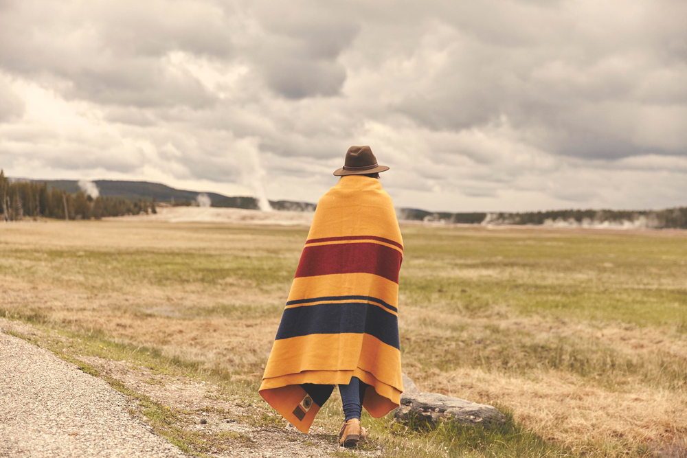 OurFreeWays_ A woman wrapped in a Pendleton Yellowstone Park blanket