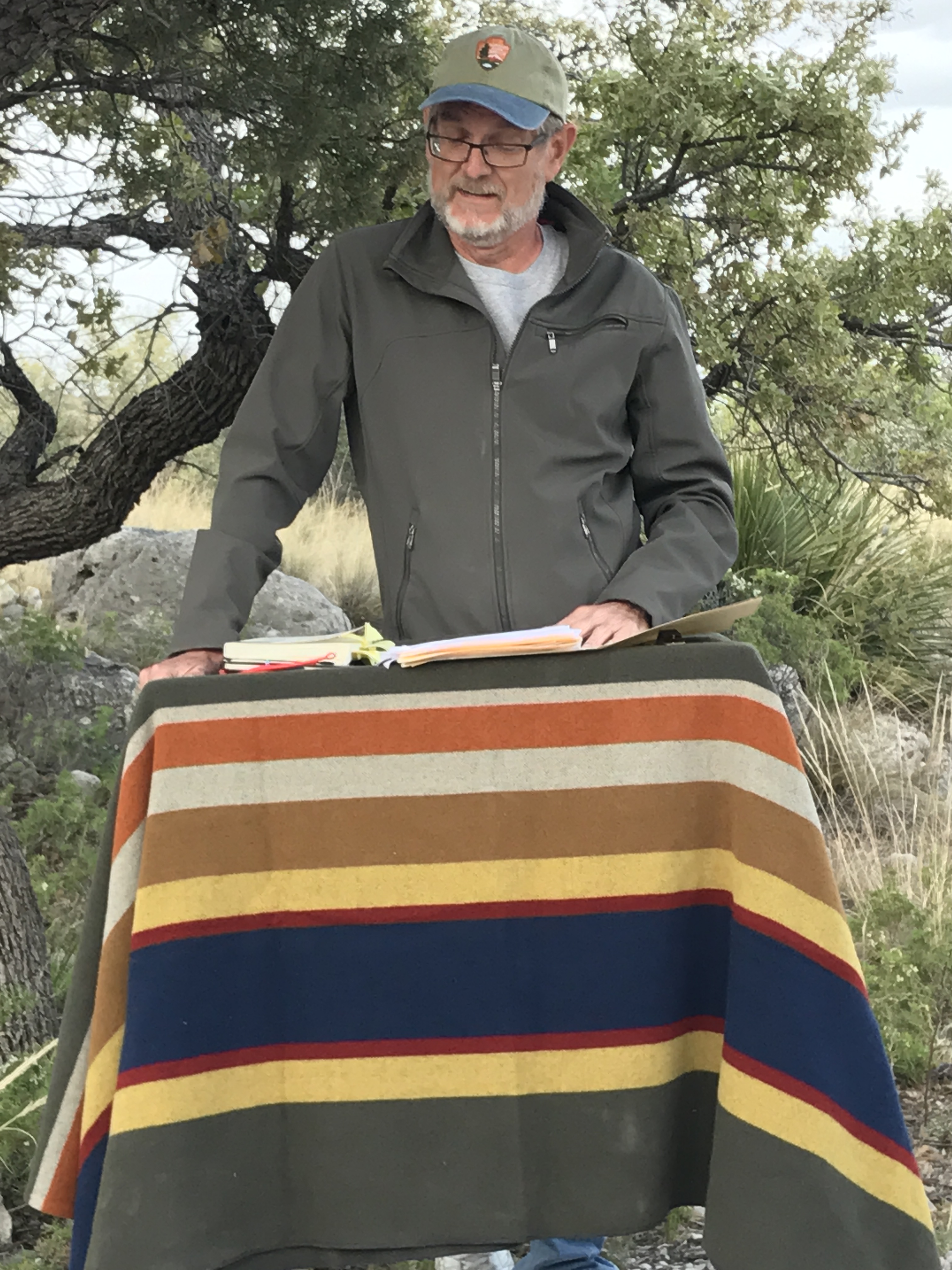 Alan Birkelbach reads a poem in the great outdoors.