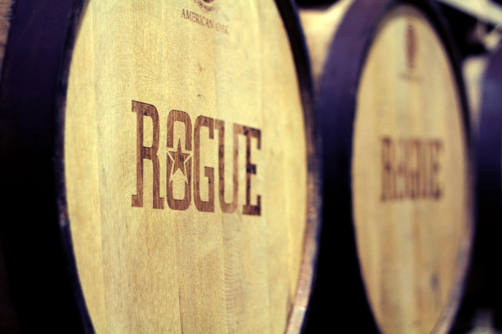 Wooden aging barrels with "Rogue" on them.