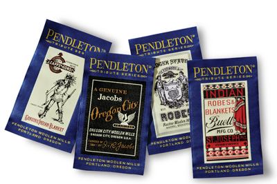 A pile of four different labels used on Pendleton's Mill Tribute series blankets. 