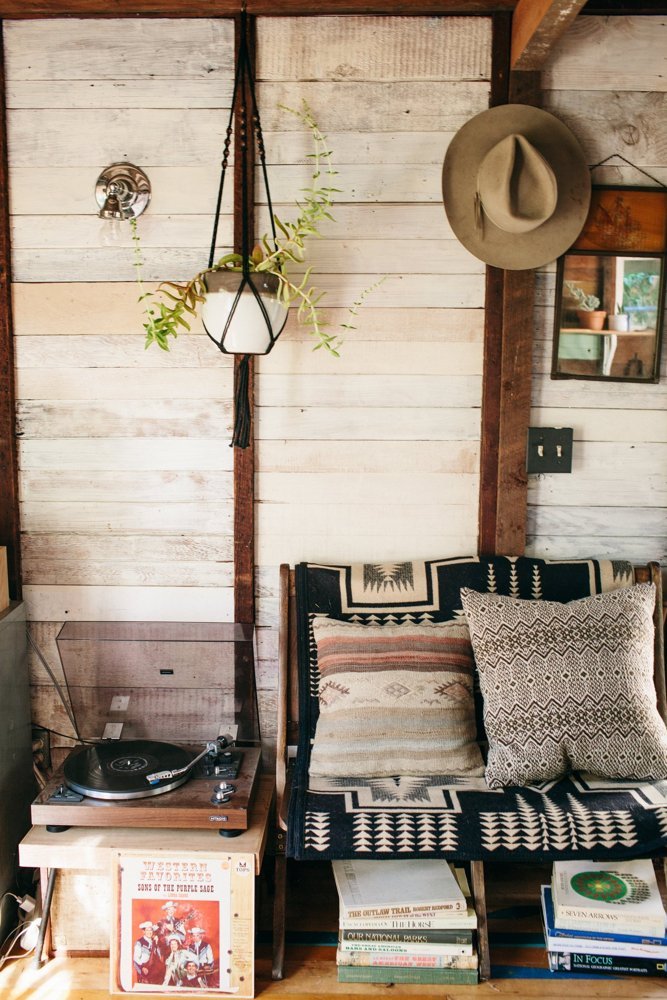 A couch covered in a Pendleton blanket. 