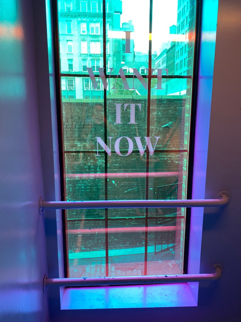 "I WANT IT NOW" - window decal inside Showfield's.