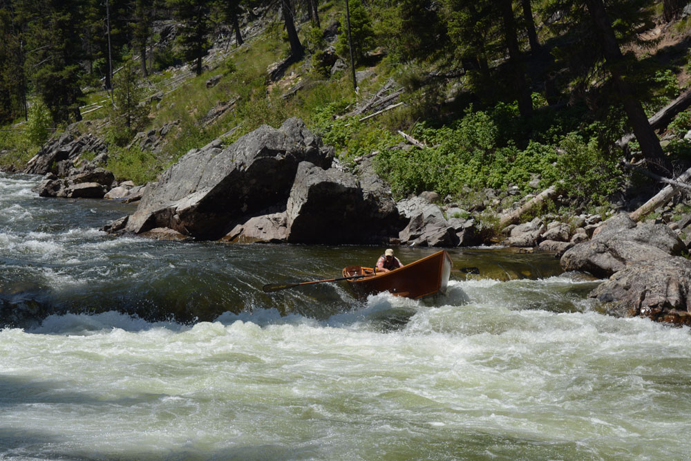 Greg Haten in his wooden boat on River of No Return in the Frank Church Wilderness of Idaho. Photo by Greg Hatten