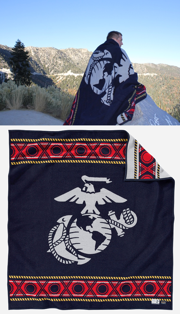 Man stands on hilltop with USMC Pendleton blanket.