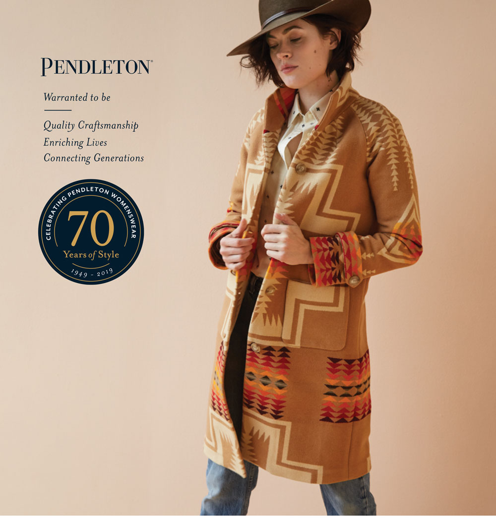 woman wearing hat and wool blanket coat by Pendleton