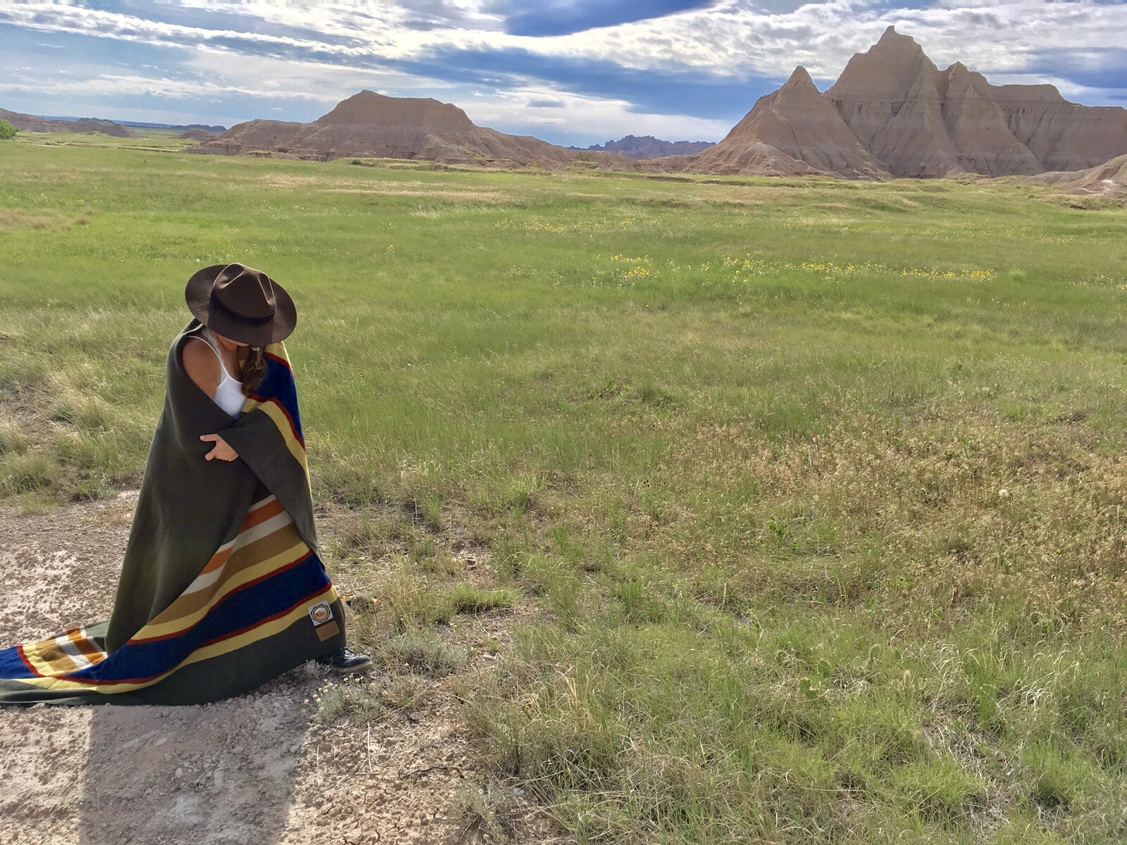 the Poet Laureate of the national parks, poses in the Badlands of North Dakota with a Badlands blanket.