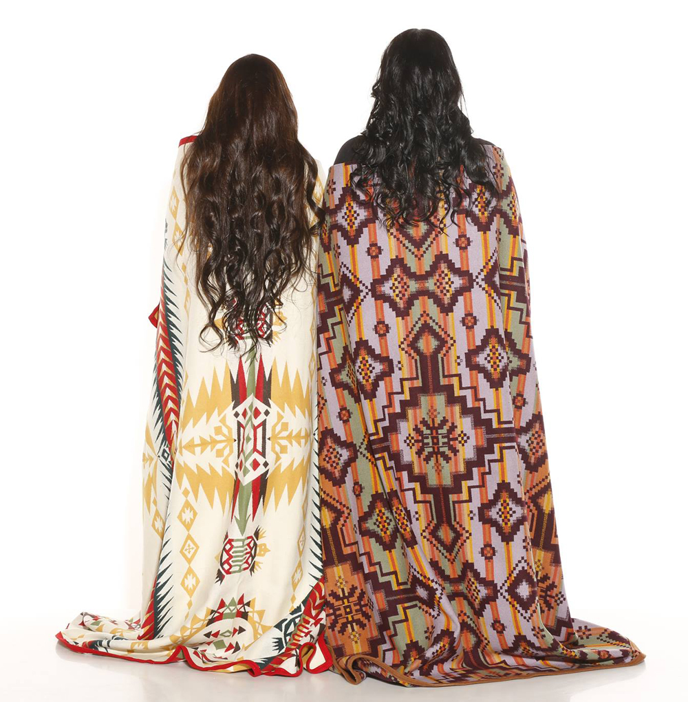 Mother and daughter wrapped in Pendleton blankets