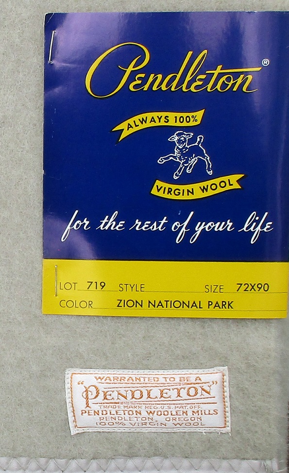 1950s Pendleton Zion Park blanket with cardboard tag and white and gold Pendleton label.