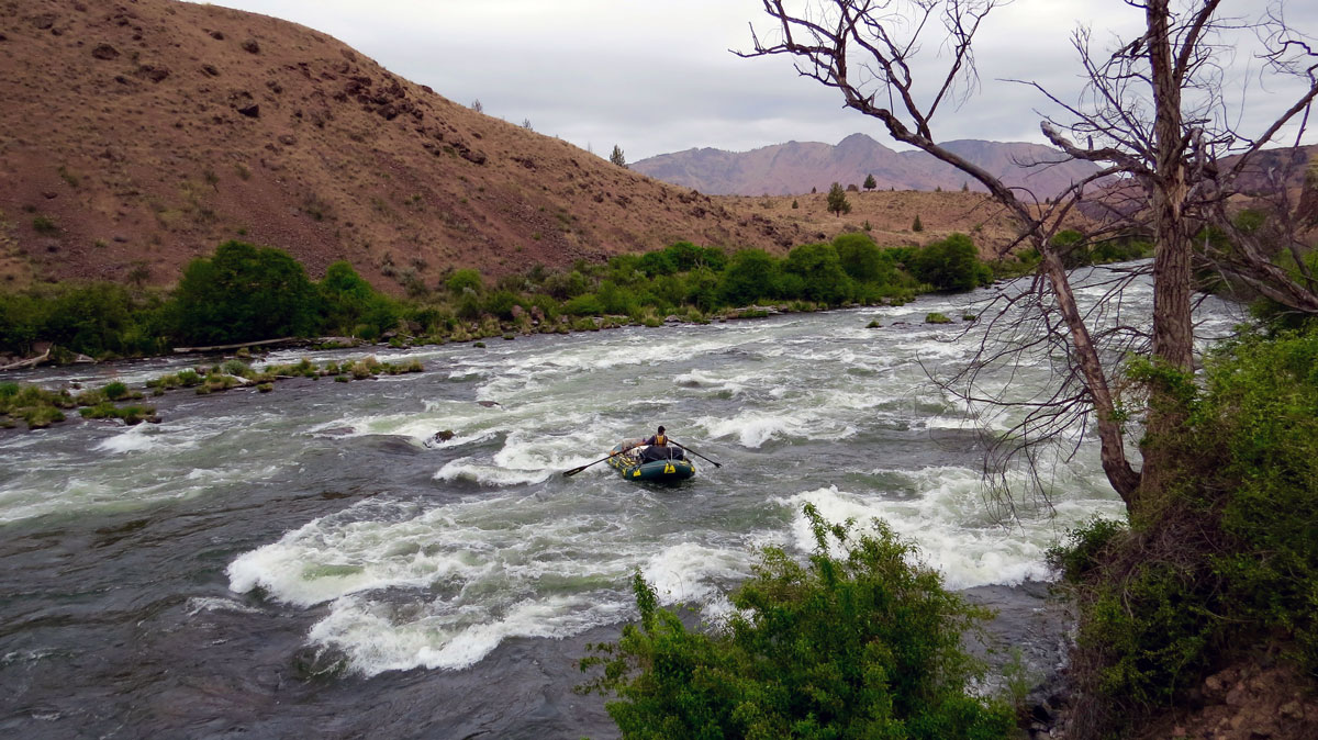 A rafter on the rapids of Oregon's Deschutes River. Photo by Greg Hatten