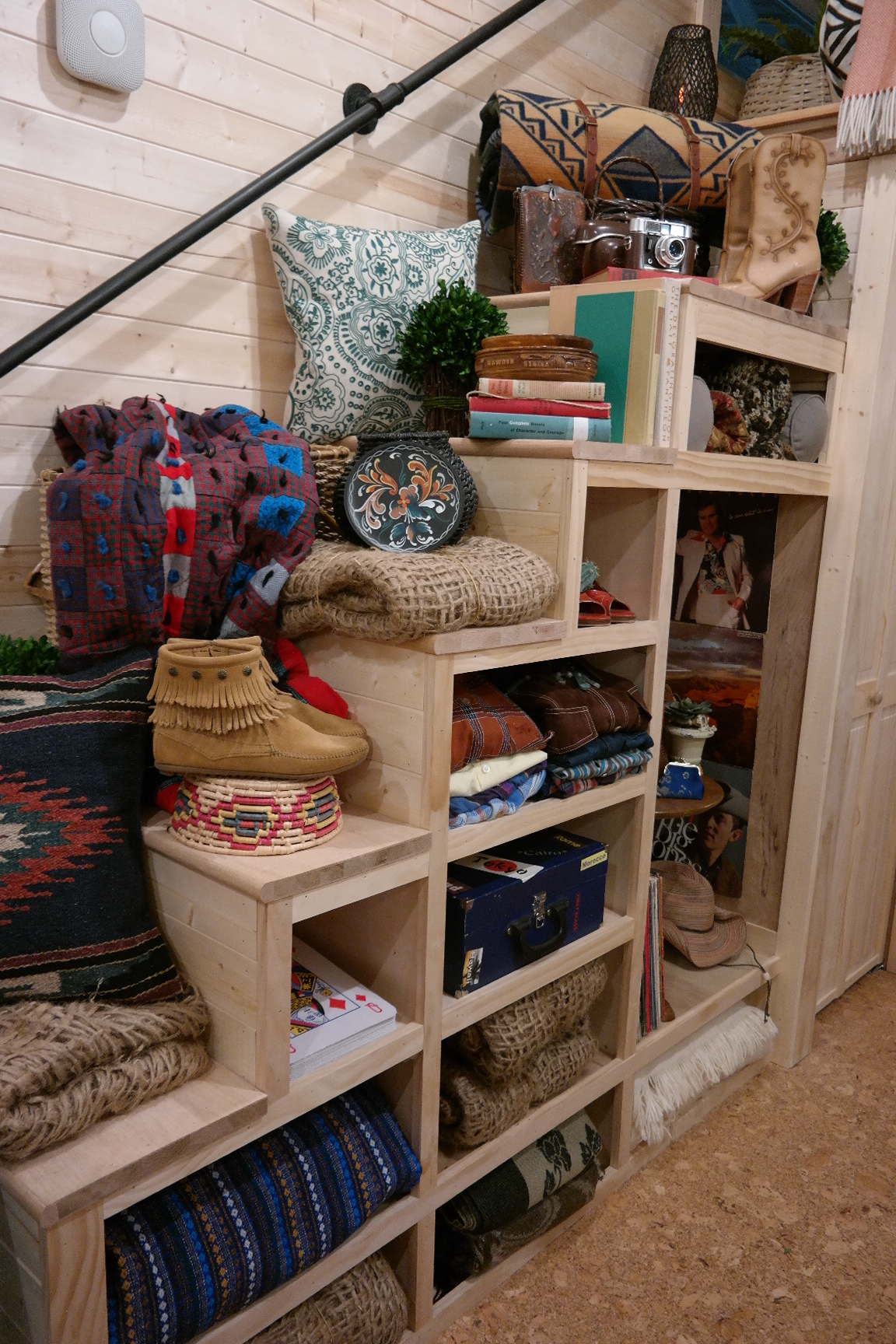 the staircase decorated with western decor items, including a Pendleton blanket. 