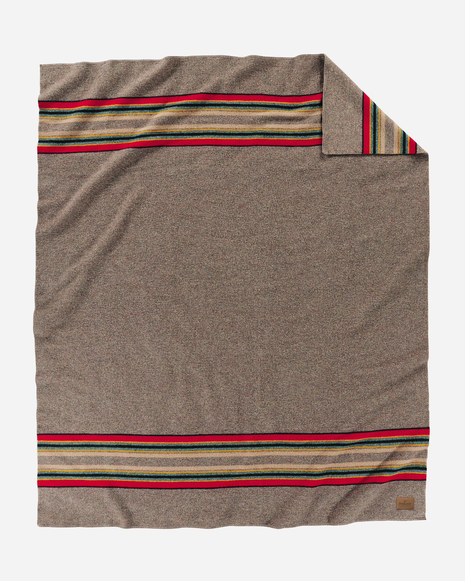 A Yakima Camp blanket in heathered taupe, with bands of red, green and tan at each end. By Pendleton. 