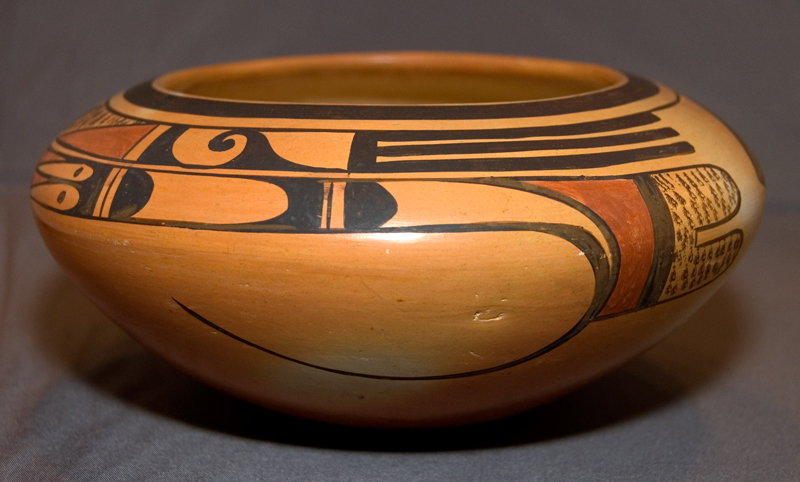 An antique Hopi clay pot glazed in tones of gold, rust, and black. Photo by Holly Chervnsik, used with permission