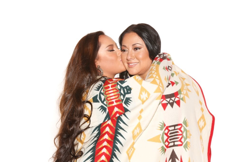 Mother and daughter wrapped in Pendleton blankets