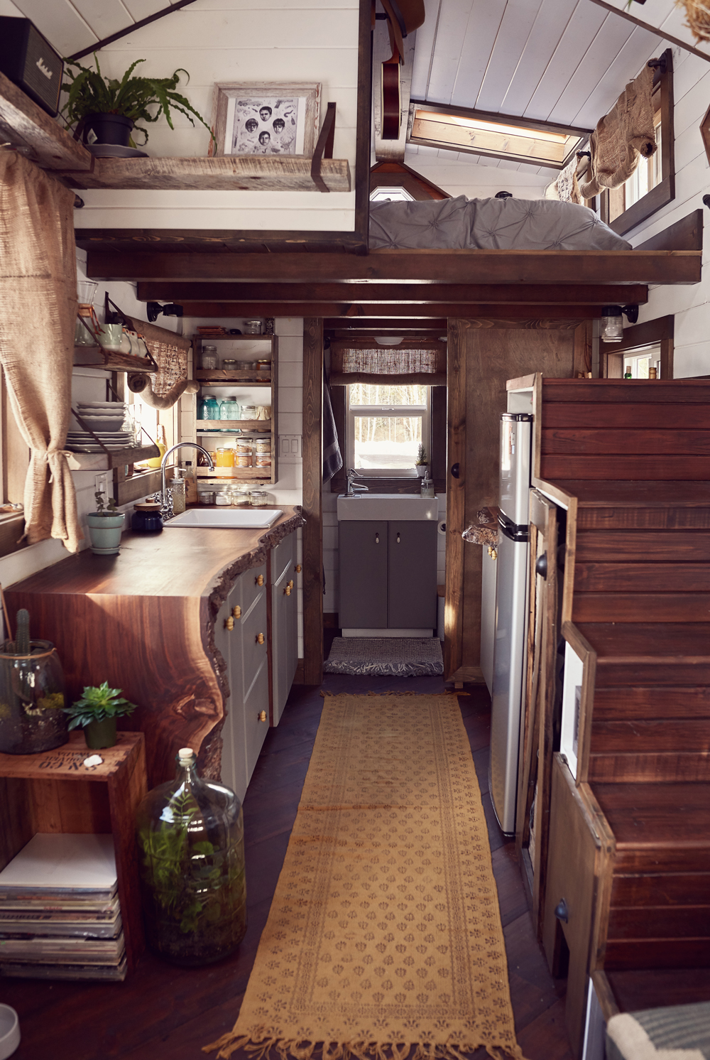 tamara_jaswal: Tiny home interior with view of kitchen and sleeping loft