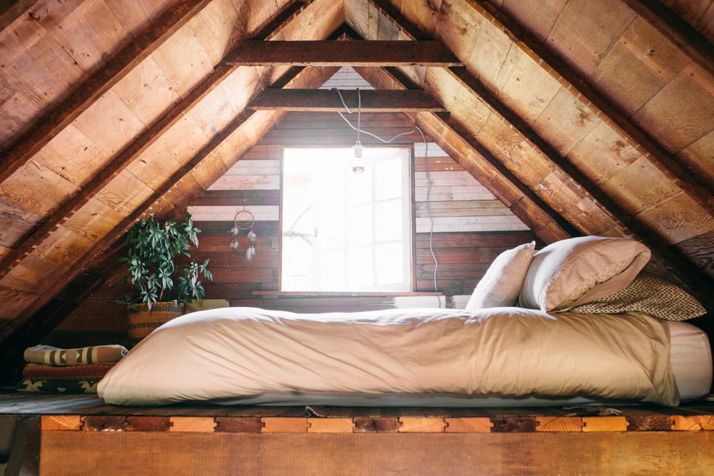 A sleeping loft in a tiny home.