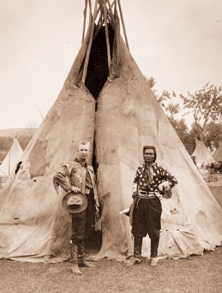 Roy Bishop and Jackson Sundown pose in front of the family teepee of Jackson Sundown.