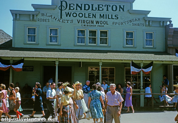 Disneyland guests outside the Pendleton Woolen Mills Dry Goods Emporium in Frontierland.