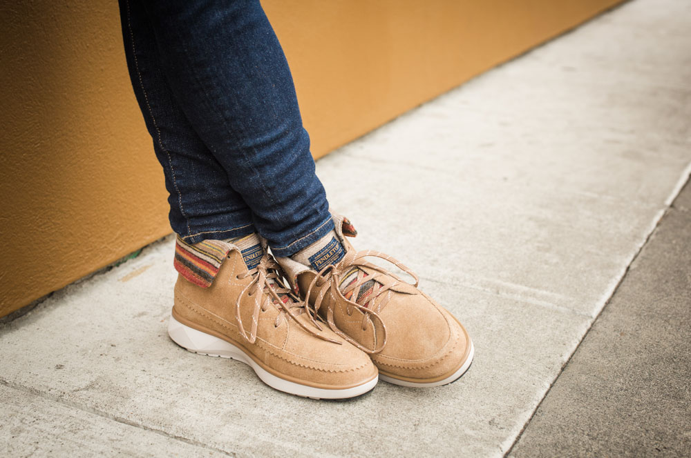 Man's feet wearing Pendleton boots in suede and wool..