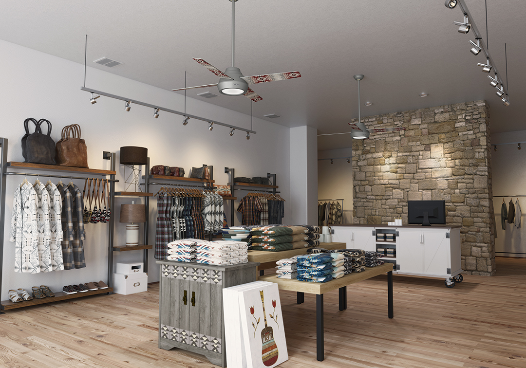 A boutique selling floor featuring the silver Pendleton x Hunter fan with the Canyonlands pattern. The boutique has white walls, wood floors, and a stone wall behind the cash wrap. 