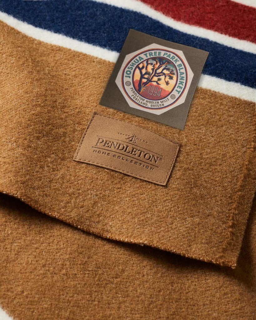 Close view of the labels for the new Joshua Tree national park blanket--one scenice, the other faux leather