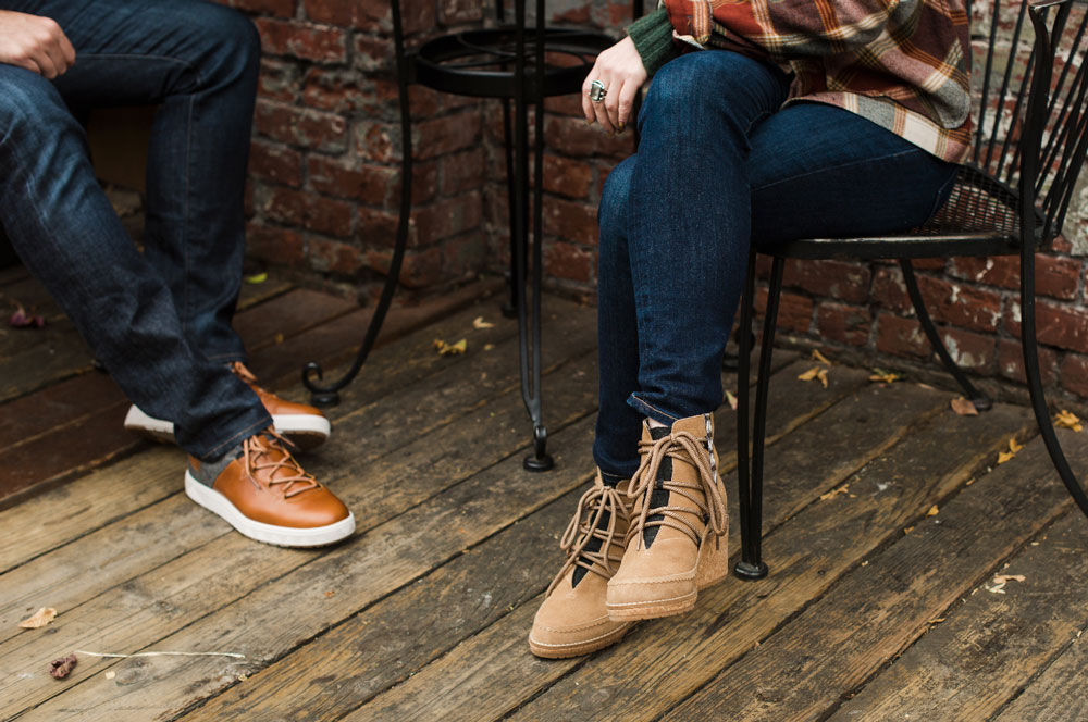 Man and woman sitting at table wearing Pendleton shoes/boots.